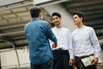 Asian guy advice map to Myanmar travellers in Bangkok city