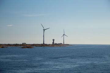 Finland Aland, Islands of Lilla Batskar outside Aland with wind mills on a sunny spring day and calm sea