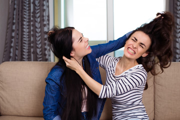 Two young women fighting