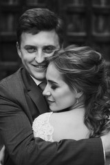 beautiful gorgeous bride and groom kissing. happy wedding couple hugging and embracing at old castle. happy romantic moments. elopement concept. sensual love. space for text