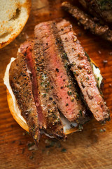 Sliced angus steak served on bun with horseradish sauce 