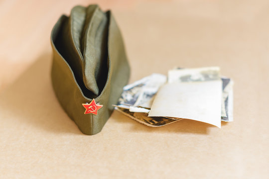 Victory Day. The Anniversary Of The War. The May 9 Celebrations. Military cap  and photos in memory of the war.