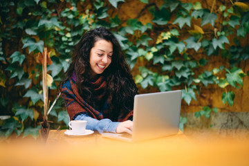 Woman having coffee while working in garden