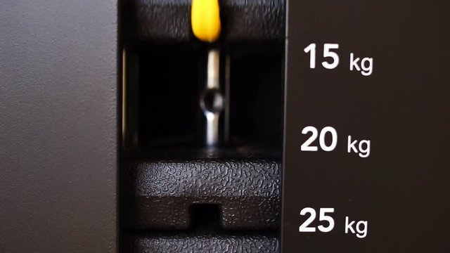 Close up plate stacked of weight machine in gym