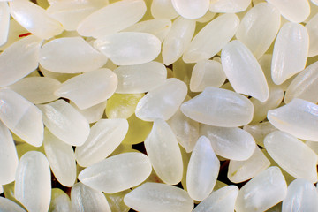 background of grains of cereals of white raw rice