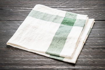 kitchen cloth (napkin) on wood background