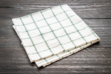 kitchen cloth (napkin) on wood background