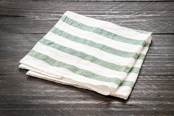 kitchen cloth (napkin) on wood background
