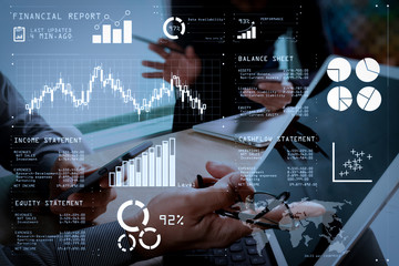 two colleague web designer discussing data and digital tablet docking keyboard and computer laptop with smart phone and design diagram on marble desk,sun light effect