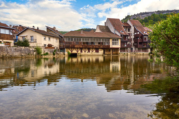 Fototapeta na wymiar Ornans Cityscape Aside Loue River - Doubs - France