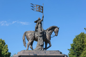 bronze statue of Prince Vladimir on a horse with flag and St. Theodore. the Golden ring of Russia