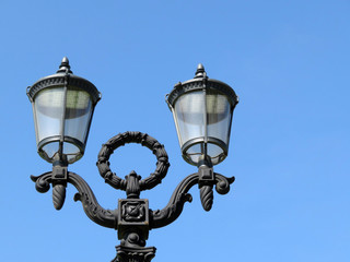 Fototapeta na wymiar LED street lamp isolated on clear blue sky. Vintage lantern with modern lighting technology