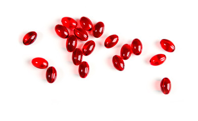 Vitamin E. Capsules of red color with vitamin e oil on a white background.