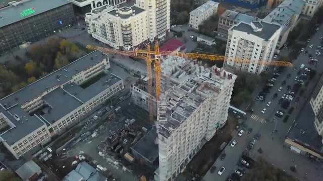 New high-rise buildings constructing in process. Video. Top view of the construction of an apartment building in the city