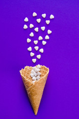 Ice Cream Cone Horn Hearts Sweethearts Candies. Flat lay Top View. Love,Valentines day concept. Summer Party, Birthday Firework Ultra Violet background. Bright Sweet Color. TrendyStyle.