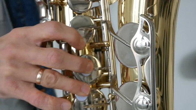 Man playing saxophone close up