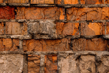 Cracked concrete vintage orange brick wall background