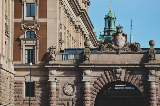 Details of art and decor on Building of The Parliament House of Sweden built in Neoclassical style, with a centered Baroque Revival style facade section in the Gamla stan, old town of Stockholm