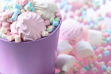 Violet pail with various marshmallows.