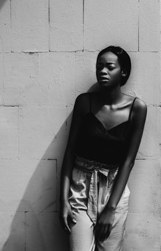 Portrait of a black female fashion model posing  on gray background