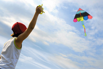 Child launches a kite