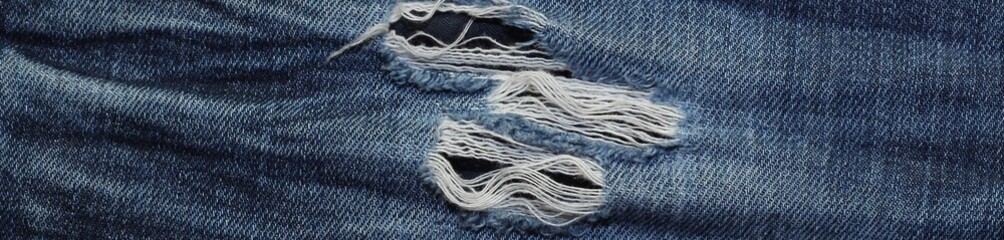 Banner of Blue Jean texture with a hole and threads