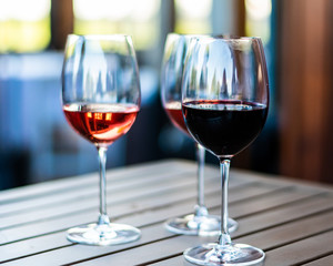 Three Wine Glasses on Wooden Table
