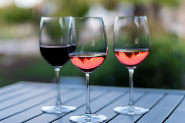 Three Wine Glasses on Wooden Table