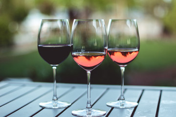 Three Wine Glasses on Wooden Table