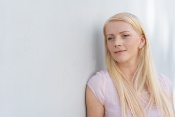 Outdoor portrait of dreamy blonde woman