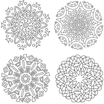 A set of black and white mandalas. Decorative round ornaments. Wicker design elements. Logos for yoga, backgrounds for posters, icons for programs and websites. The unusual shape of the flower. 