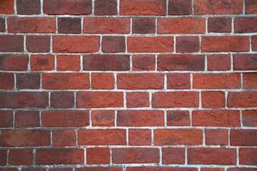 old wall of red threadbare brick