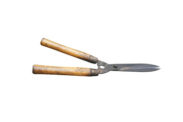 Old grass shears with wooden handle isolated on white background