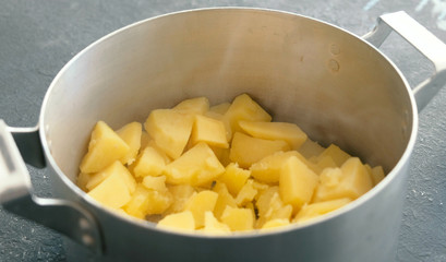 Closeup boiled potato in saucepan. Cooking mashed potatoes.