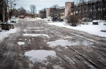broken and dirty road, Russia