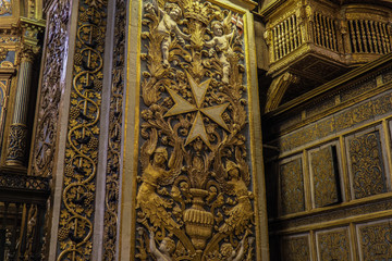 Valletta, Malta St John Roman Catholic Co-Cathedral interior art. Maltese cross symbol vertex detail inside Baroque art and architecture church built for the Knights of St John.