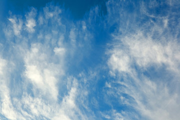Background of transparent white clouds in a light blue sky illum