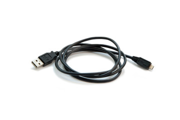 Black USB cable on white background. USB and USB-mini cable connectors close-up. A patch cable or patch cord or patch lead.
