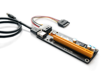 Adapter or riser PCI-E for mining on video cards. Device for adaptation 1X PCI-E to 16X slot and add video graphic cards to motherboard. Closeup on white background.