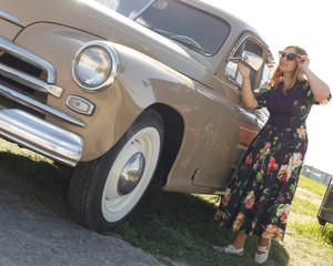 Woman near retro car