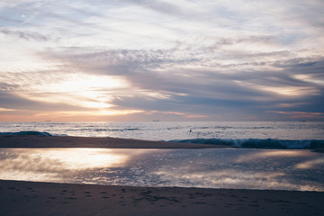 Naklejka na ściany i meble An amazing sunset on the coast at the ocean