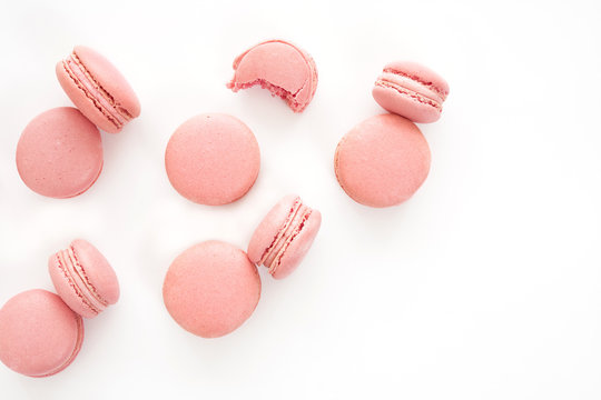 Classic french pink macarons on white background. Isolated