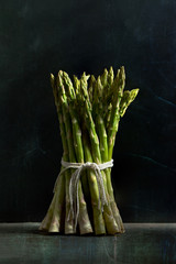 Bunch of asparagus rustic in dark mood