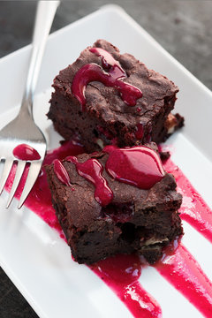 Chocolate Brownie Bars With Raspberry Sauce.