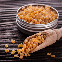 frankincense essential oil on a wooden background