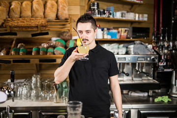 Male barista with lemonade
