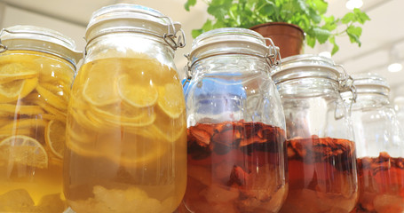 Glass bottle of compote in restaurant