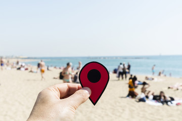 man with a red marker in La Barceloneta beach