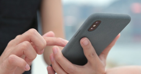 Business woman using smart phone at outdoor