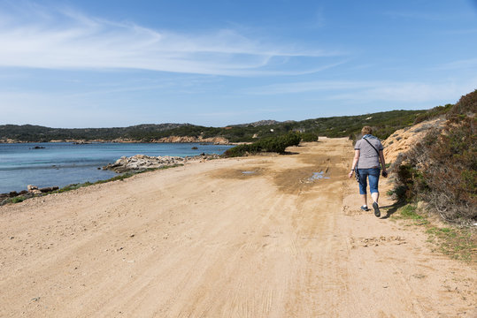 woman walking on caprera island